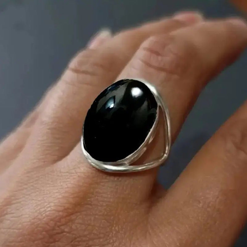 Bague pierre noire ovale, anneau ajouré, ton argenté, taille 52 — VoxArcana